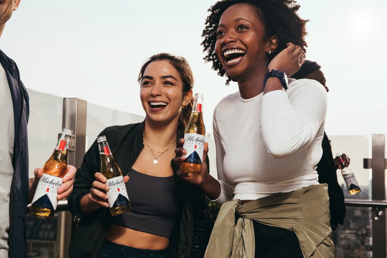 A picture containing person, person, drinking michelob ultra